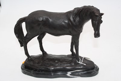 Lot 230 - A reproduction bronze model of a horse on...