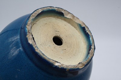 Lot 231 - A Chinese blue glazed stem vase (drilled),...