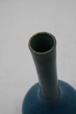 Lot 231 - A Chinese blue glazed stem vase (drilled),...