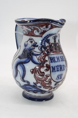Lot 282 - A 20th century faience pottery jug, the...