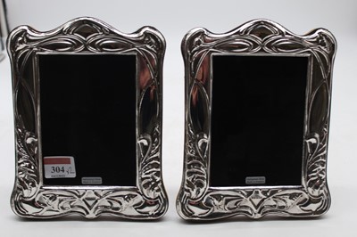 Lot 304 - A pair of modern silver clad easel photograph...