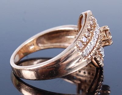 Lot 2585 - A 9ct yellow gold crossover diamond ring,...