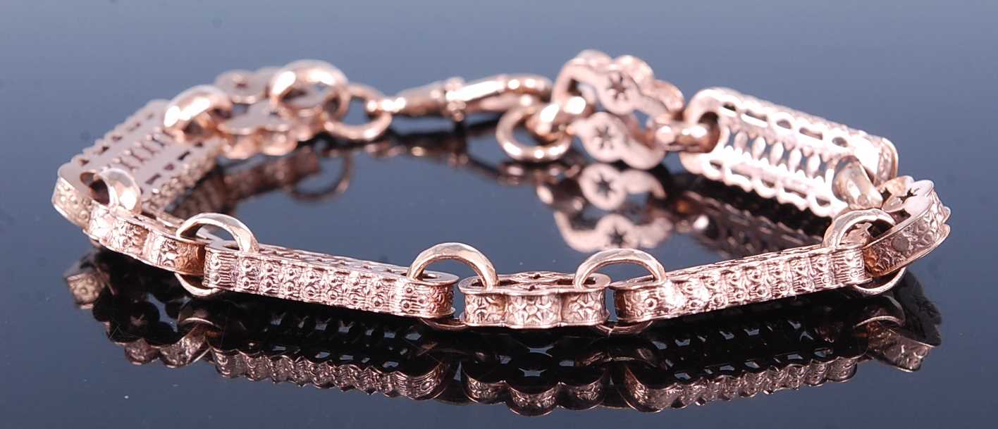 Lot 2598 - A rose metal fancy link bracelet, comprising...