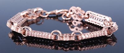 Lot 2598 - A rose metal fancy link bracelet, comprising...