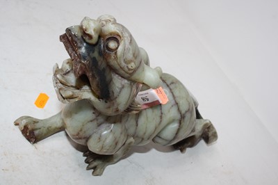 Lot 58 - A polished soapstone figure carved as a dog of...