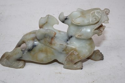 Lot 58 - A polished soapstone figure carved as a dog of...