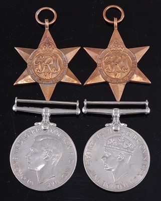 Lot 68 - A group of four WW II medals, to include...