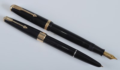 Lot 97 - Two Parker fountain pens, in black with gold...