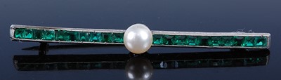 Lot 2602 - A white metal, synthetic emerald and simulated...
