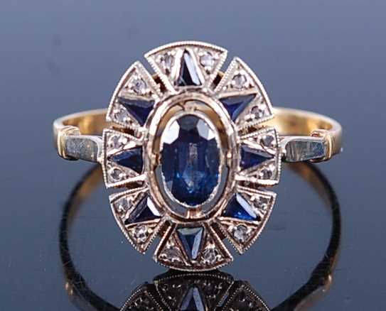 Lot 2632 - A yellow and white metal, sapphire and diamond...