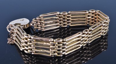 Lot 2615 - A 9ct gold gatelink bracelet with textured...