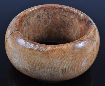 Lot 400 - An early 20th century African ivory bangle, of...
