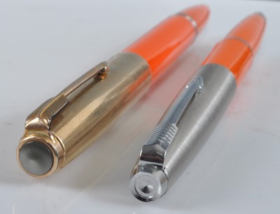 Lot 96 - Two Parker fountain pens in orange, one being...
