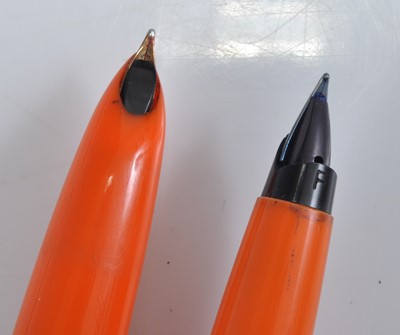 Lot 96 - Two Parker fountain pens in orange, one being...