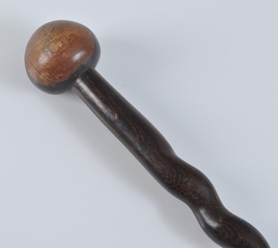 Lot 185 - A carved ironwood knobkerrie, having a typical...
