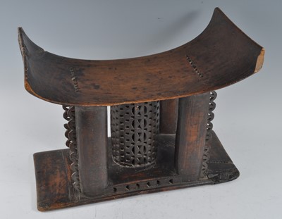 Lot 182 - A large carved hardwood Kings stool, having a...