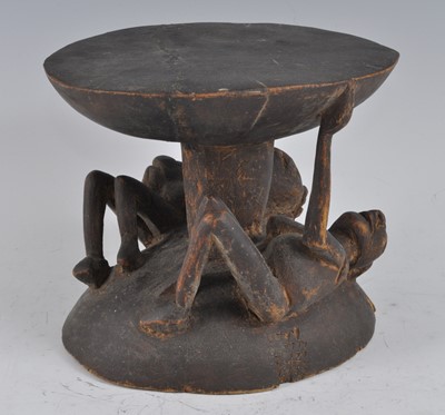 Lot 2401 - A wooden Elders stool, the circular top...