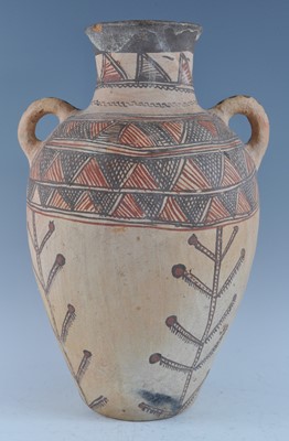 Lot 2405 - A large pottery twin handled vase of amphora...