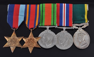 Lot 222 - A WW II group of five medals, to include...