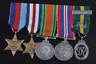 Lot 144 - A group of five medals, to include 1939-1945...