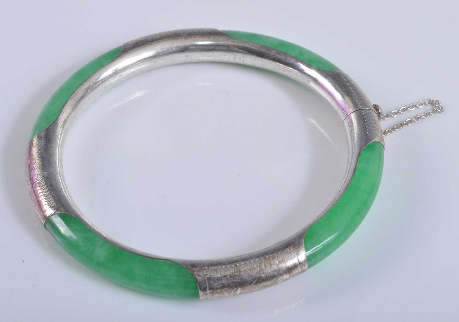 Lot 2639 - A late 20th century white metal and nephrite...