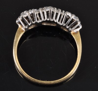 Lot 2647 - An 18ct yellow and white gold diamond triple...