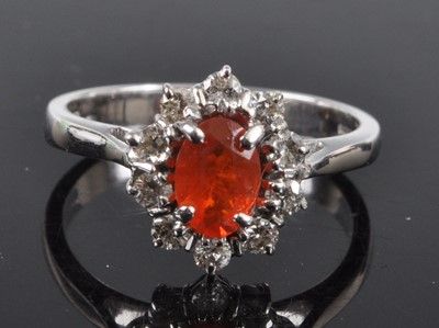 Lot 2650 - An 18ct white gold, fire opal and diamond oval...