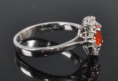 Lot 2650 - An 18ct white gold, fire opal and diamond oval...