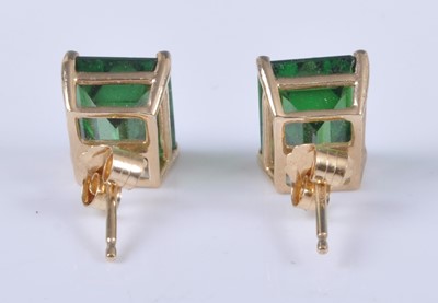 Lot 2659 - A pair of yellow metal earrings, each with a...