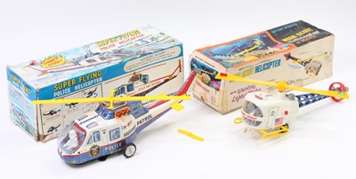 Lot 1855 - 2 boxed vintage battery powered Helicopter...