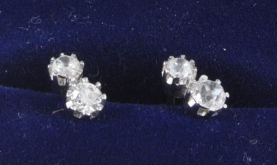 Lot 2674 - A pair of 18ct white gold diamond set ear...
