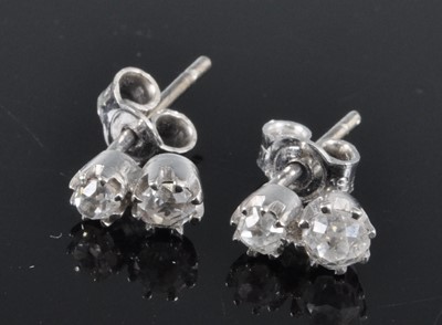 Lot 2674 - A pair of 18ct white gold diamond set ear...