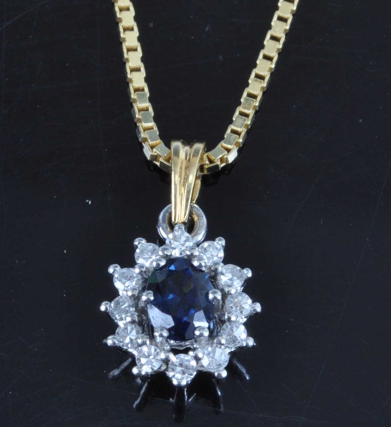 Lot 2697 - An 18ct yellow and white gold, sapphire and...