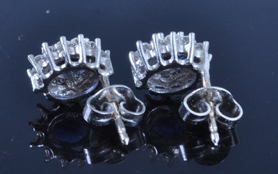 Lot 2698 - A pair of 18ct white gold, sapphire and...