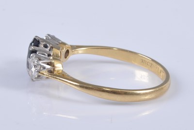 Lot 2665 - An 18ct gold, sapphire and diamond three stone...