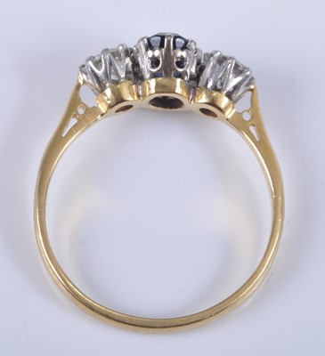 Lot 2665 - An 18ct gold, sapphire and diamond three stone...