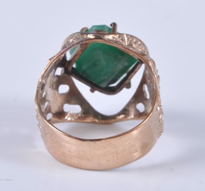 Lot 2667 - A yellow metal emerald set dress ring, the...
