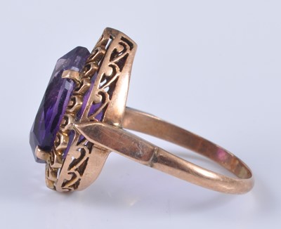 Lot 2678 - A yellow metal and amethyst set dress ring,...