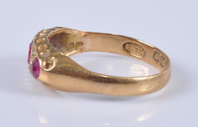 Lot 2685 - An 18ct gold, ruby and diamond ring, arranged...