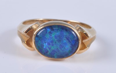 Lot 2687 - A yellow metal opal doublet set dress ring,...