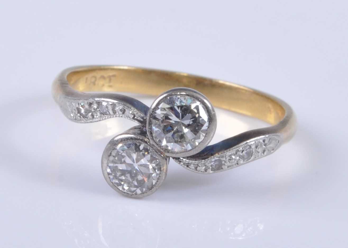 Lot 2688 - A yellow metal diamond crossover ring, the...