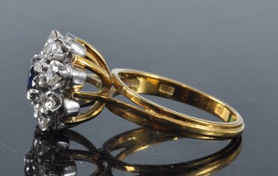 Lot 2703 - An 18ct gold, sapphire and diamond flower head...