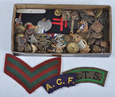 Lot 14 - A collection of cap badges, buttons and...