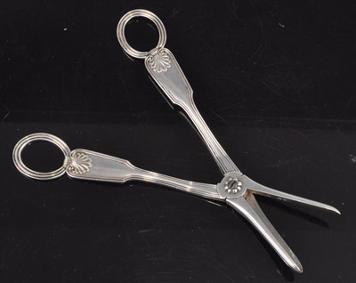 Lot 1089 - A pair of Victorian silver grape scissors, in...