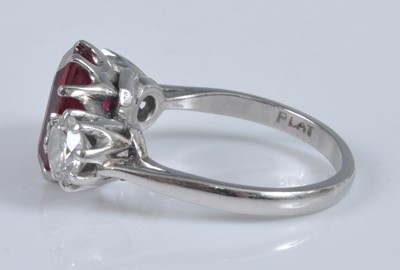 Lot 1125 - A white metal, synthetic ruby and diamond...