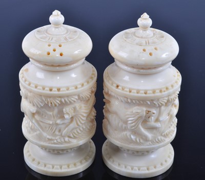Lot 393 - A pair of early 20th century Indian ivory salt...