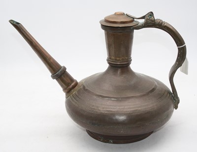 Lot 28 - An early 20th century Arabic copper kettle of...