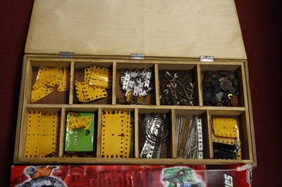 Lot 52 - A plywood box containing various loose Meccano...