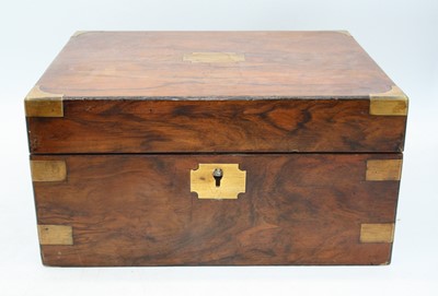 Lot 33 - A Victorian walnut and brass bound work box...