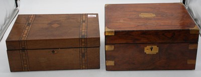 Lot 33 - A Victorian walnut and brass bound work box...